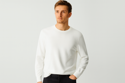 Caucasian model in white crewneck sweater and black jeans