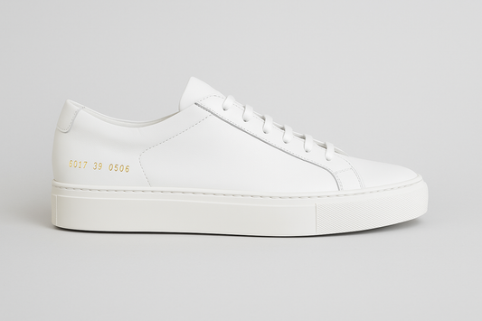Clean side view of Common Projects Tournament sneakers