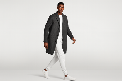 Model in white outfit with charcoal blazer